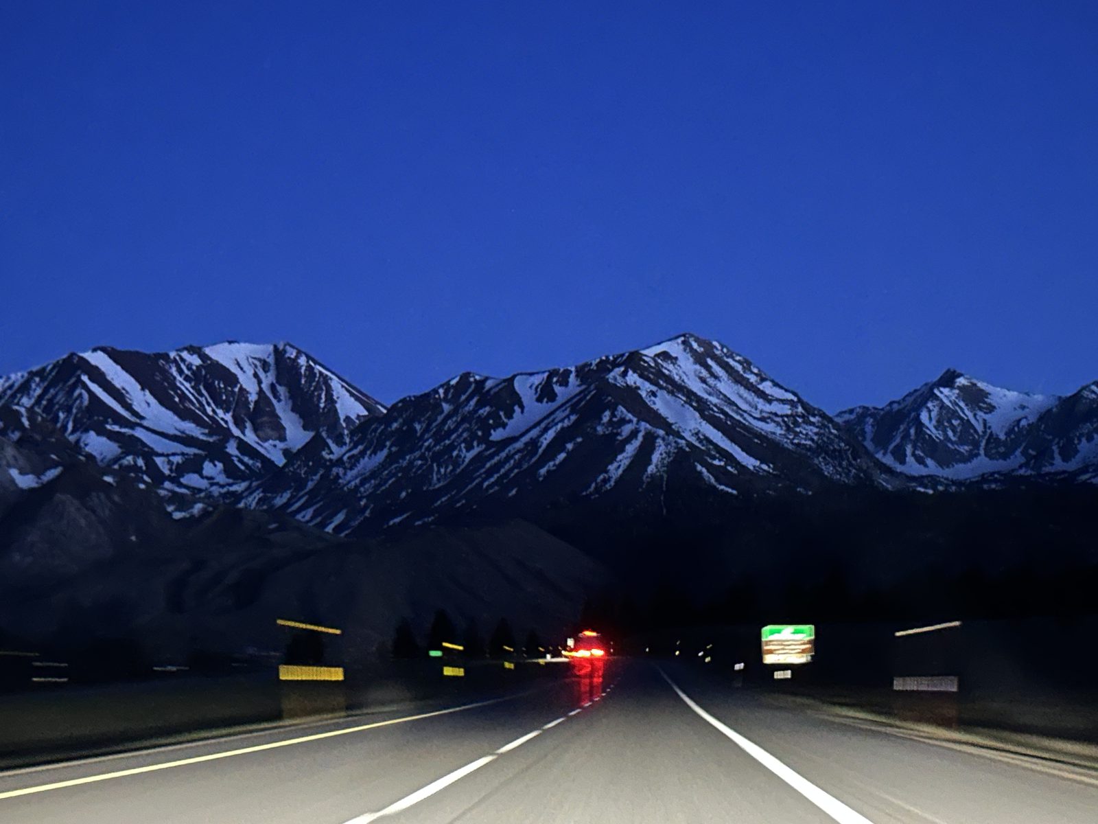 Snow-capped Eastern Sierra peaks at dusk along US-395